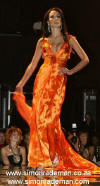 Model Cara in a beautiful tangerine gown designed by Mr Rademan.  Photograph by Lisa Hnatowich