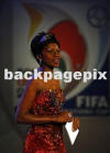 Carol Manana, wearing Simon Rademan, at the FIFA draw in Johannesburg